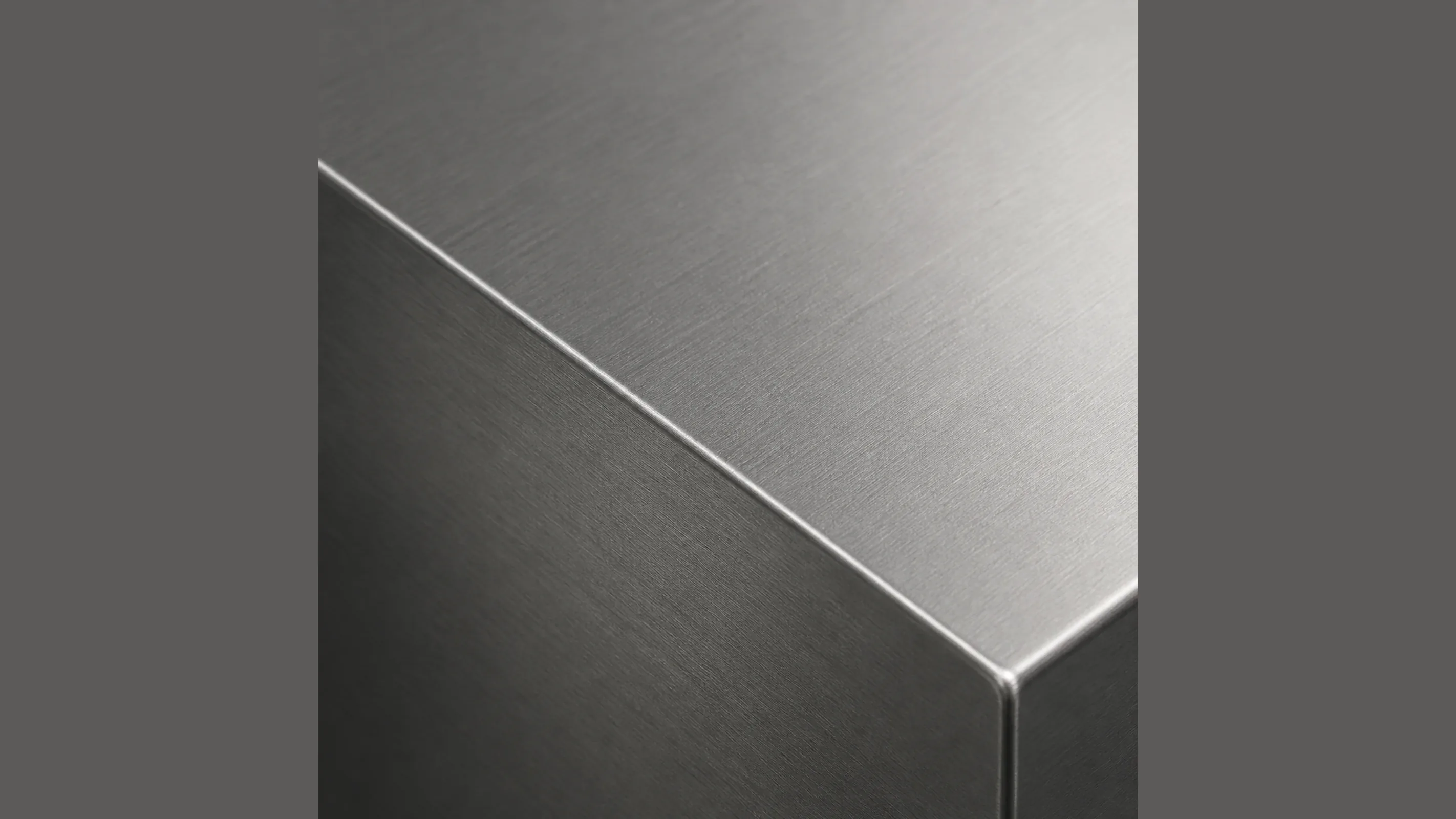 Representative brushed stainless study — the standard finish for patch fittings, rails and pull handles on frameless glazing